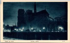 NOTRE DAME CHURCH PARIS FRANCE at Night Vintage Postcard B21 picture