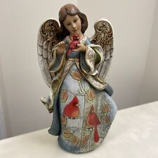 Joseph's Studio by Roman, Inc. Angel Holding Cardinal Resin Figurine picture
