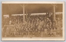 RPPC Large Crowd Mostly Men on Bleachers Real Photo Man Crutches Postcard A47 picture