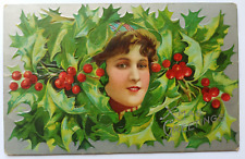 Antique 1909 Christmas Greetings Young Women's Face Around Holly Leaves Postcard picture