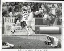 1980 Press Photo Denver Broncos Maurice Harvey flies into the air in Cleveland picture