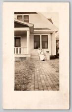 RPPC Woman on Sidewalk at House with Baby c1907  Postcard F24 picture