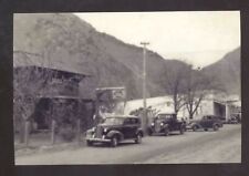 REAL PHOTO RIGGINS IDAHO DOWNTOWN STREET SCENE OLD CARS POSTCARD COPY picture
