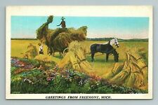 Greetings From Freemont Hay Horses Field Work Wagon Michigan MI Postcard picture