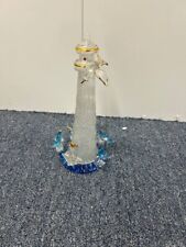 Nautical Themed Lighthouse with Gold Accents picture