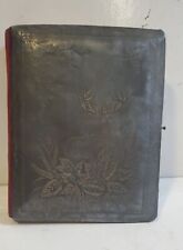 Empty antique velvet photo album with embossed deer on the cover picture