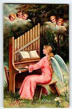 Christmas Postcard Seated Winged Angel Plays Piano Cherubs Watching 1912 Germany picture