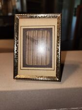 vintage MCM bi-fold 2-1/4 x 3-1/4 picture frame with gold tone non-tarnish metal picture