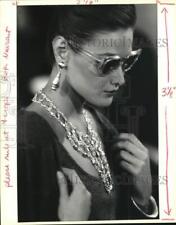 1990 Press Photo Model wears fashionable necklace and earrings - noc76475 picture