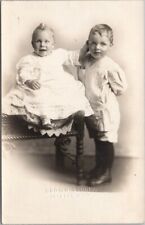 1910s JACKSON Michigan Studio RPPC Photo Postcard Baby Pulling at Brother's Ear picture