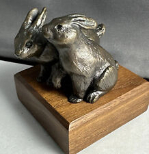 Small Double Rabbit Bronze Figure On Wooden Block picture