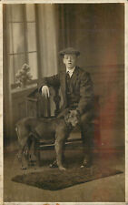 RPPC Postcard Well Dressed Teen Boy & Faithful Black Dog Studio Photo Unknown UK picture