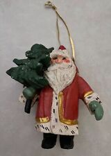 1994 HOUSE of HATTEN Holiday Ornament Red Santa Claus Holding a Christmas Tree picture