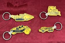 LOT 4 YELLOW RUBBER K. C. CANARY KEYCHAINS STEAMROLLER DUMP TRUCK EXCAVATOR picture