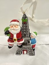 Santa Claus And Snowman Climbing Eiffel Tower, Paris Themed Ornament Presents picture