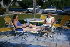 1963 35mm Slide Two Women at Patio Table Smoking Ford Cars Webbed Chairs #1250 picture