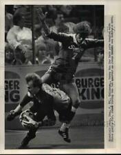 1985 Press Photo Perry Van Der Beck gets tangled with Force goalie P.J. John picture
