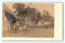 RPPC International Photo of Kids on Dirt Road Huts Fencing P Vintage Postcard D3 picture