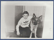 Beautiful boy playing with a dog. Soviet Vintage Photo USSR picture