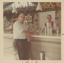 1960's Found Photo - Vintage Photo Man Enjoys Beer While Bartender Smiles At Him picture