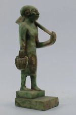 In a perfect scene The Egyptian High priest standing and holding the AXE picture