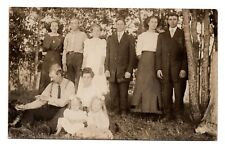 RPPC POSTCARD CIRCA 1920s LARGE FAMILY OUTSIDE DAD PLAYING WITH DOG UNPOSTED picture