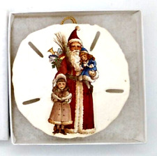 Christmas Ornament Sand Dollar Young Girl Carols While Santa Carries Young Girl picture