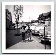 Photograph VTG Automobiles Boys Cars Town Buildings Street View Fashion 1950's picture