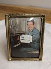 Vtg. Liberace standing picture in photo frame at piano. picture