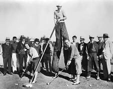 Stilt golfer with a very long club January 17 1931 Historic Old Photo picture
