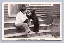 Woman Feeding Baby Bear 1000 Lakes Resort RPPC Upsala Ontario Photo ~1940s picture