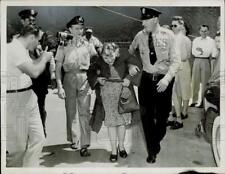 1949 Press Photo Stowaway Lavinia Ross is escorted from British Genius in Miami picture