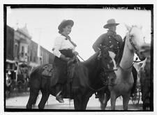 Cowgirl,cowboy on horseback,Newton,Harvey County,Kansas,KS,1908,smiling picture