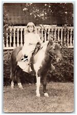 c1905 Candid Girl Horse Pony Saddle Bridle Flowers RPPC Photo Unposted Postcard picture