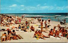 Florida Beach Scene - Sand, Sunbathers Mailed in 1965 from Ormond Beach Postcard picture