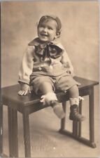 Vintage 1910s Studio Photo RPPC Postcard Very Happy Smiling Little Boy on Table picture