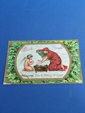 Antique Merry Christmas Postcard 1910 WOMAN KEEPING WARM WITH ANGEL SNOW BRAZIER picture