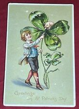 Vintage St. Patricks Day Greetings Boy Holding Giant Shamrock Pig Tucks Postcard picture