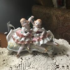 Vintage Bone China Lace Figures On A Sofa. picture