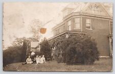 RPPC House with Young Family Sitting on Lawn c1910 Real Photo Postcard picture