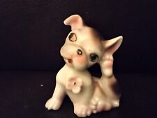 Vintage ceramic white and brown dog with flower scratching ear picture