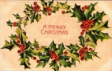 vintage postcard - A Merry Christmas wreath of holly embossed posted 1909 picture