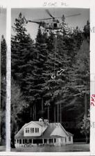 1955 Press Photo Coast Guard helicopter rescues family from flooded house in CA picture