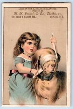 GIRL BLINDFOLDS DOG*NEWARK NJ*HH SMITH CO CLOTHIERS*VICTORIAN TRADE CARD 1880's picture