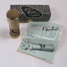 New, boxed unfired vintage CROWN GRACE LIGHTER + Instructions. Squeeze to light picture