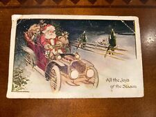 1906 CHRISTMAS POSTCARD Santa Driving Sack Full Of Candy And Toys picture