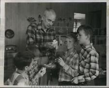 1955 Press Photo Dr. Norris E. Bradbury,holds souvenirs he brought from Eniwetok picture