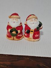 Santa Claus Salt And Pepper Shakers. Santas Holding A Christmas Wreath picture