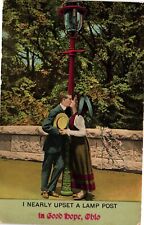 Antique Postcard Made In England Kissing Couple Upset A Lamp Post Good Hope Ohio picture