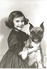 Vintage Black & White Photo of Girl with Missing Teeth Posing with Her Boxer Dog picture